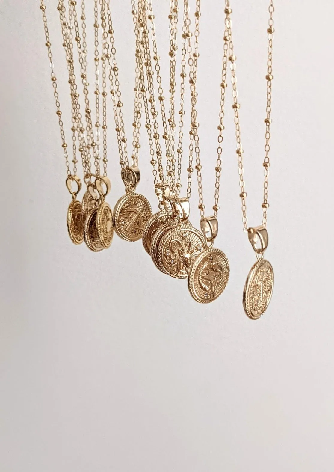 Gold Zodiac Coin Necklaces by Layer the Love