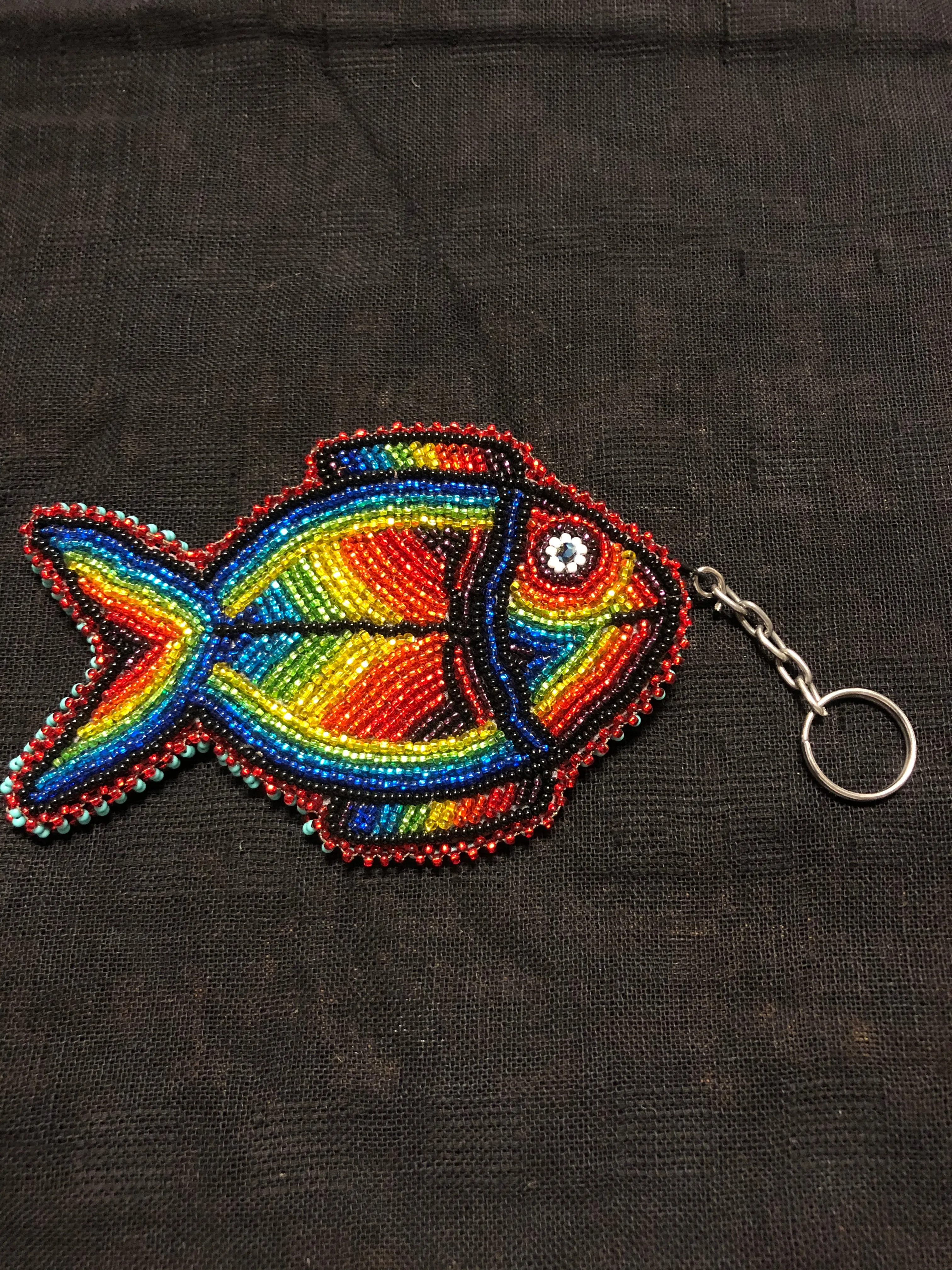 Guatemalan handcrafted glass bead round change purse with key ring. 3.5” diameter.  Fish design.