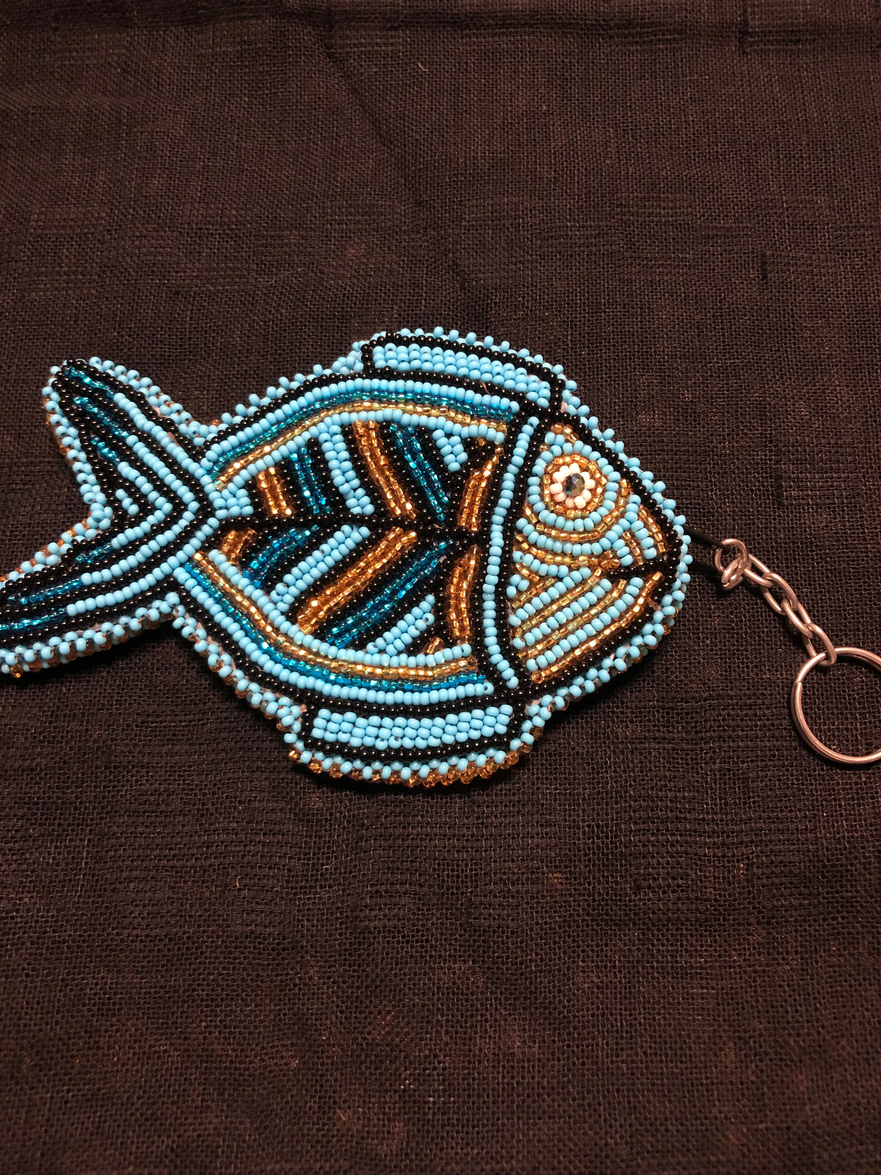 Guatemalan handcrafted glass bead round change purse with key ring. 3.5” diameter.  Fish design.