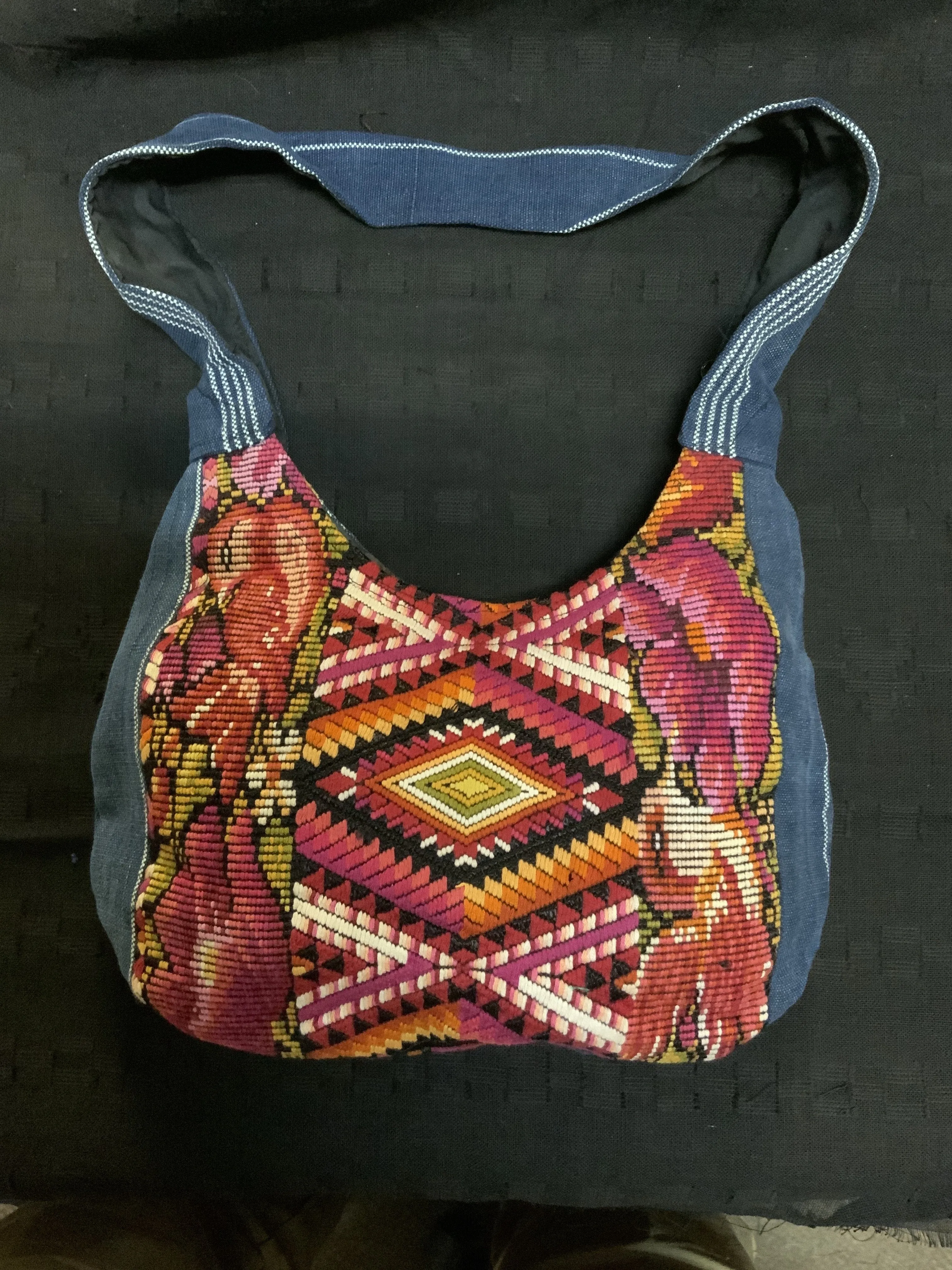 Guatemalan vintage huipil fabric made into a shoulder purse. 11” wide by 7” at its narrowest point. Note the strap is not full l