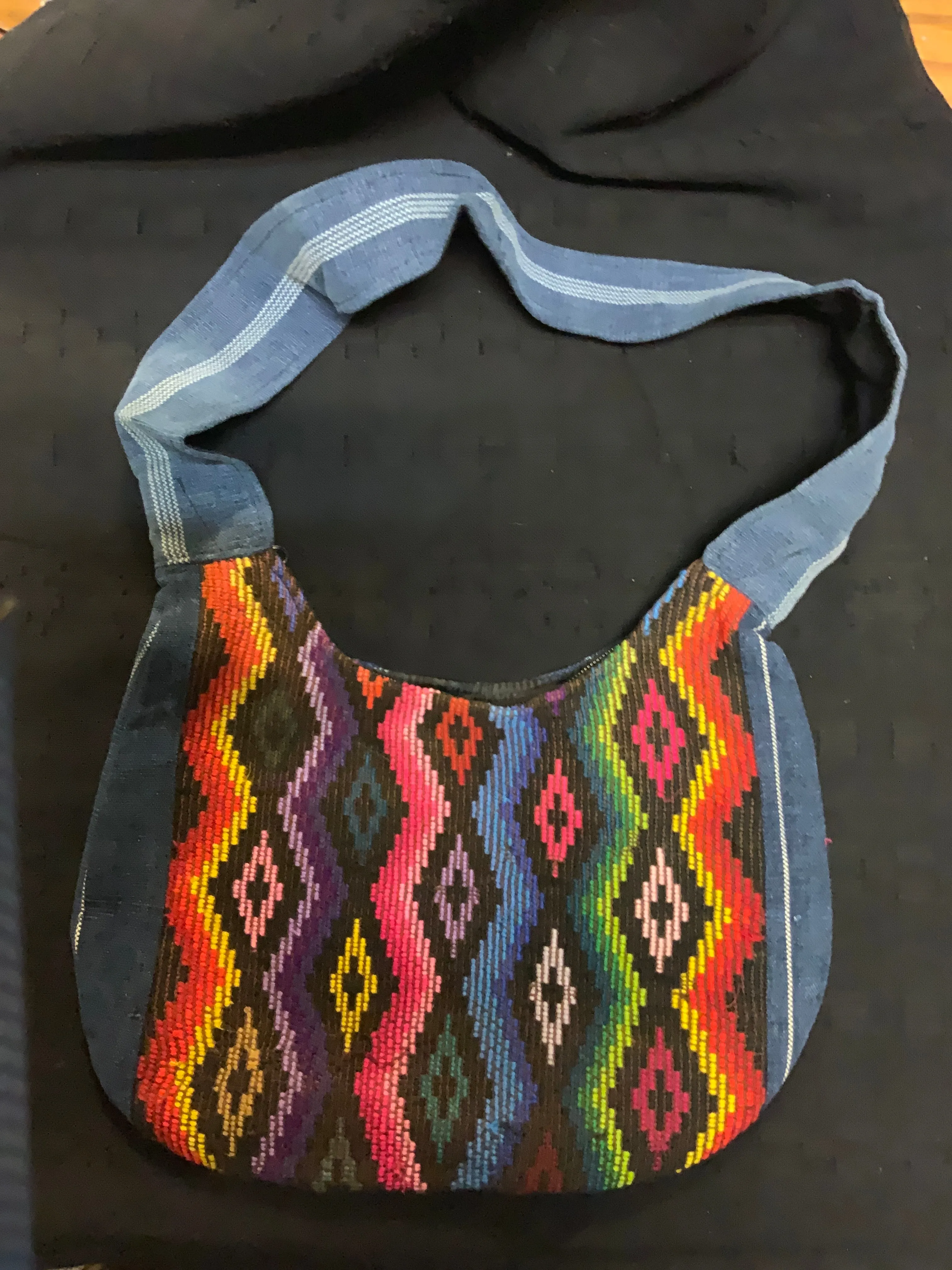 Guatemalan vintage huipil fabric made into a shoulder purse. 11” wide by 7” at its narrowest point. Note the strap is not full l