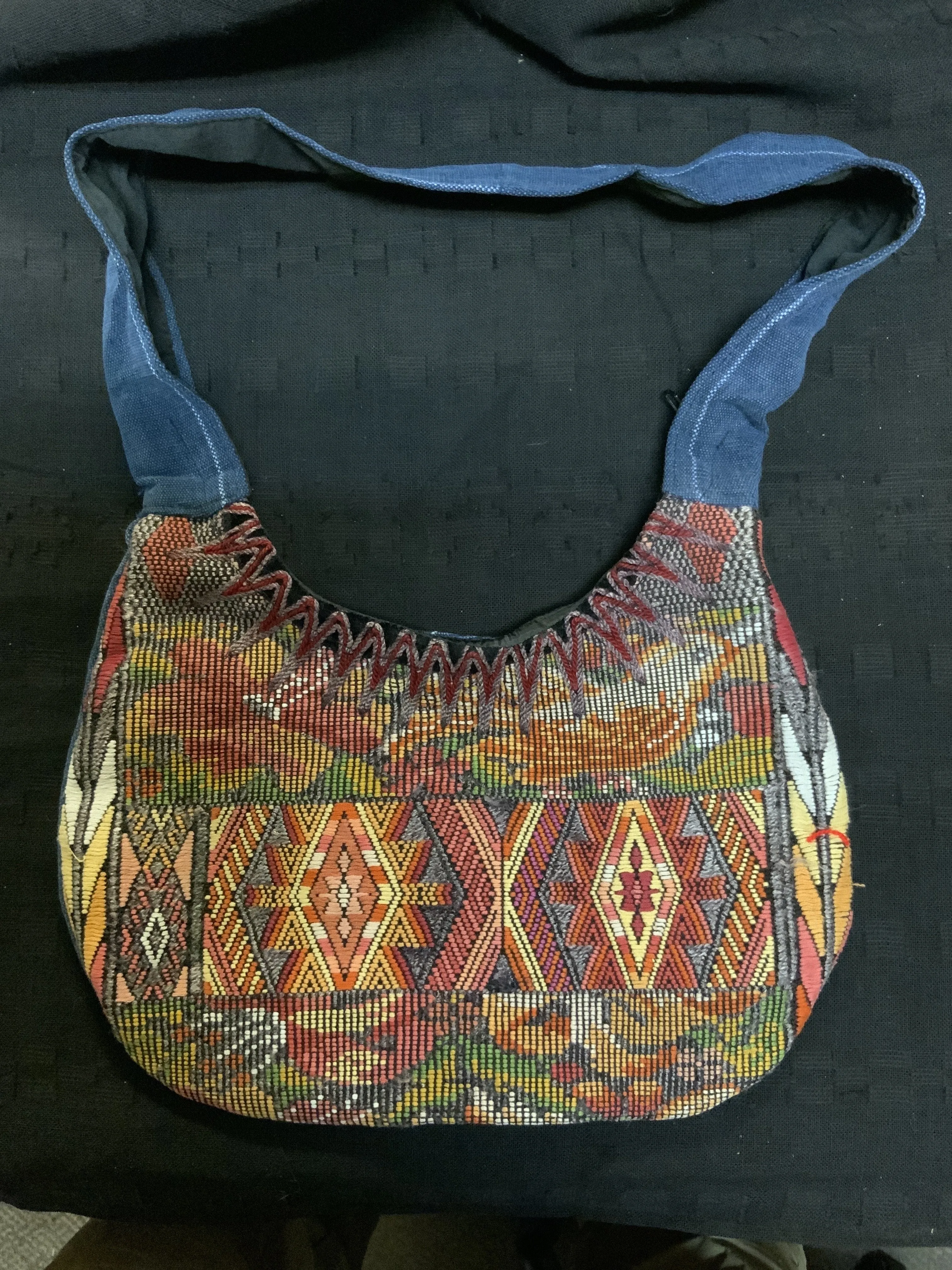 Guatemalan vintage huipil fabric made into a shoulder purse. 11” wide by 7” at its narrowest point. Note the strap is not full l