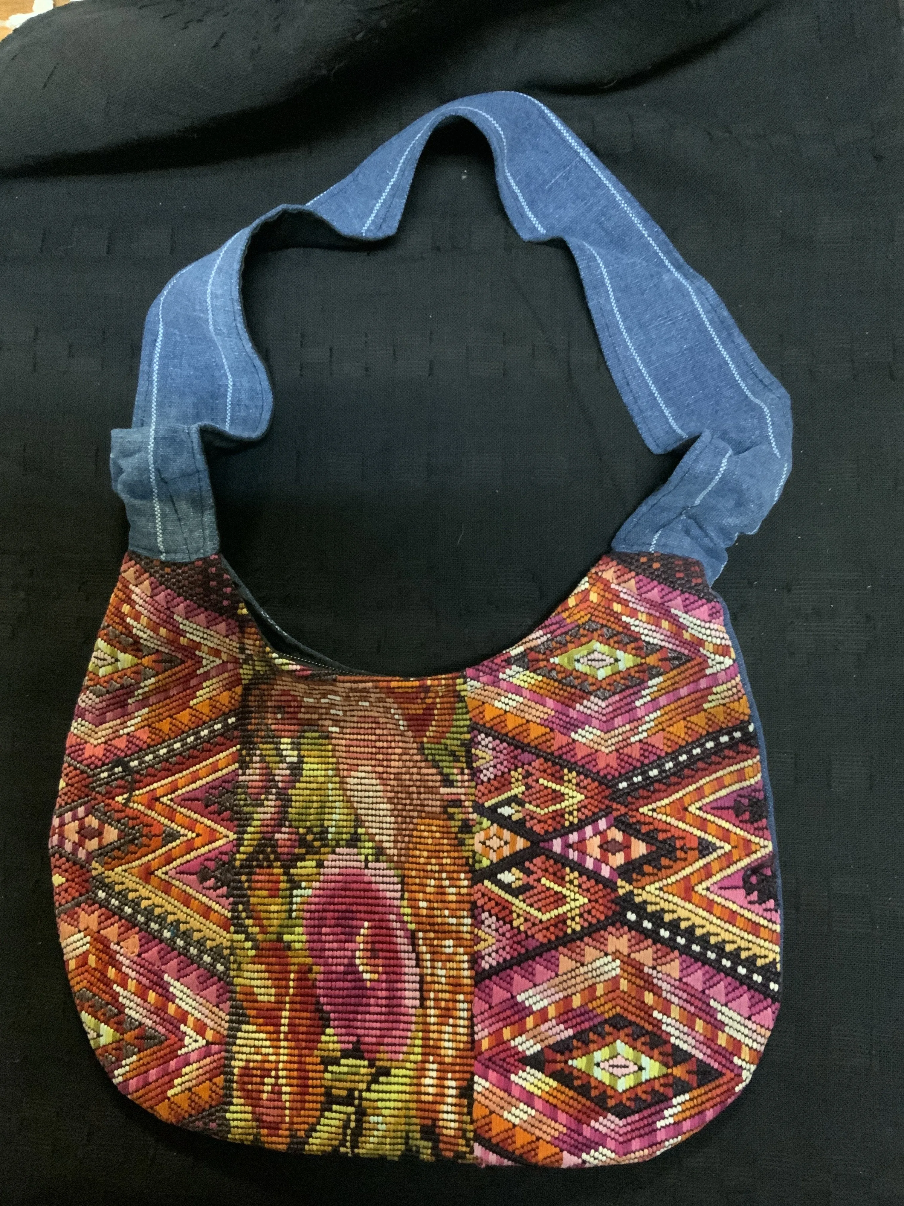 Guatemalan vintage huipil fabric made into a shoulder purse. 11” wide by 7” at its narrowest point. Note the strap is not full l