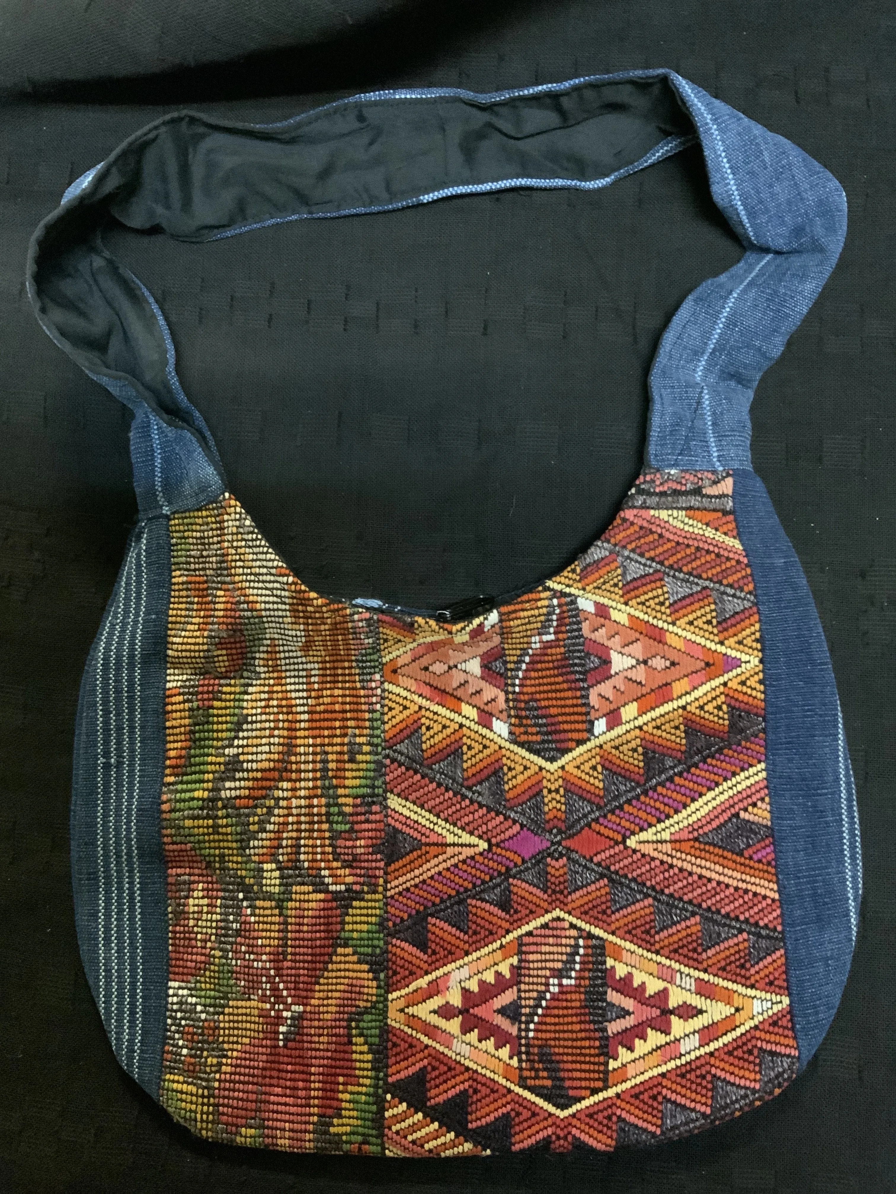 Guatemalan vintage huipil fabric made into a shoulder purse. 11” wide by 7” at its narrowest point. Note the strap is not full l